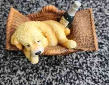 Statue of a dog in a basket Tbilisi