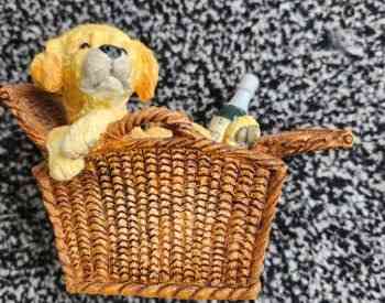 Statue of a dog in a basket Tbilisi